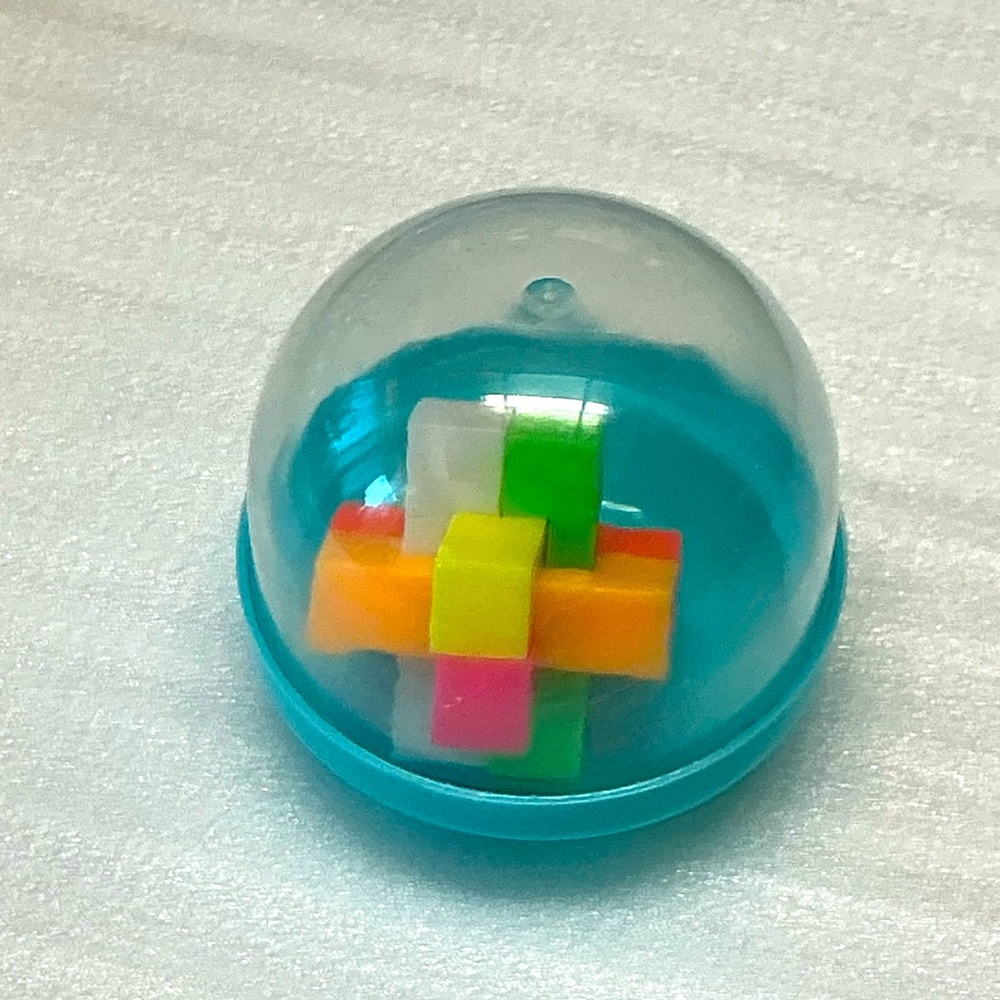 Colorful Cube Puzzle Toy in Light Turquoise Capsule